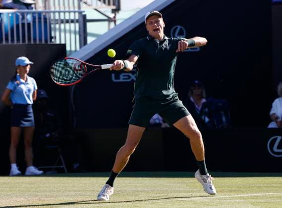 27th June 2025; Devonshire Park, Eastbourne, East Sussex, England; Lexus International Eastbourne, Day 5; Jensen Brooksby (USA) plays a forehand shot against Ugo Humbert (FRA) in the mens singles semi-final match  ActionPlus12806126 HongboxChen