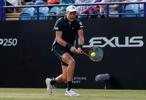 27th June 2025; Devonshire Park, Eastbourne, East Sussex, England; Lexus International Eastbourne, Day 5; Jensen Brooksby (USA) plays a backhand shot against Ugo Humbert (FRA) in the mens singles semi-final match  ActionPlus12806129 HongboxChen