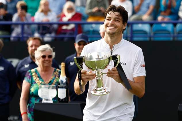 28th June 2025; Devonshire Park, Eastbourne, East Sussex, England; Lexus International Eastbourne, Day 6; Taylor Fritz (USA) celebrates his victory with the winners trophy after defeating Jensen Brooksby (USA) in the mens singles final match  ActionPlus12806405 HongboxChen