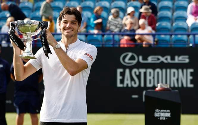 28th June 2025; Devonshire Park, Eastbourne, East Sussex, England; Lexus International Eastbourne, Day 6; Taylor Fritz (USA) celebrates his victory with the winners trophy after defeating Jensen Brooksby (USA) in the mens singles final match  ActionPlus12806413 HongboxChen