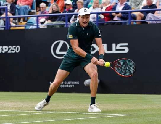 28th June 2025; Devonshire Park, Eastbourne, East Sussex, England; Lexus International Eastbourne, Day 6; Jensen Brooksby (USA) plays a backhand shot against Taylor Fritz (USA) in the mens singles final match  ActionPlus12806423 HongboxChen
