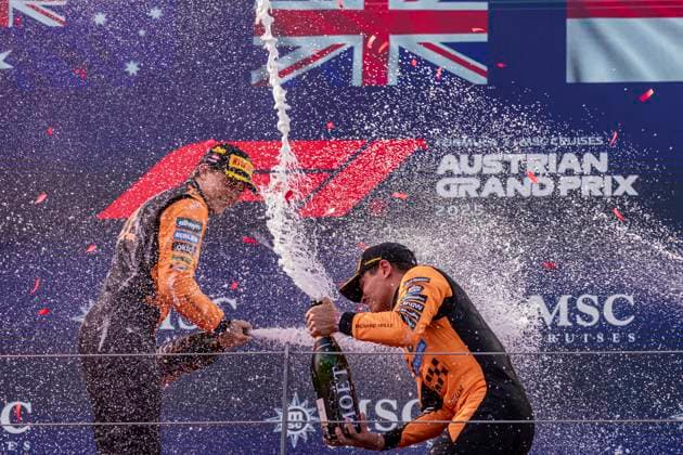 F1 Grand Prix of Austria Lando Norris in first place and Oscar Piastri in second place splash the champagne on the podium at the Formula 1 MSC Cruises Austrian Grand Prix in Spielberg, Austria, on June 29, 2025. Spielberg Austria  Copyright: xRobertxSzaniszlox originalFilename:szaniszlo-notitle250629_np9DU.jpg