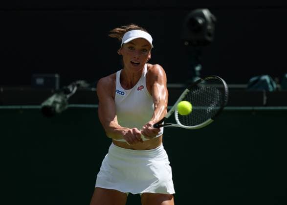30th June 2025; All England Lawn Tennis and Croquet Club, London, England; Wimbledon Tennis Tournament, Day 1; Carson Branstine (CAN) with a backhand shot to Aryna Sabalenka (BLR)  ActionPlus12807212 JohnxPatrickxFletcher