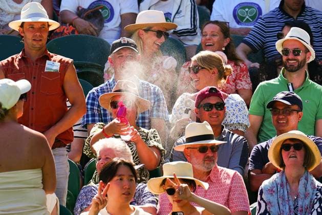 A spectator sprays water Wimbledon Tennis Championships, Day 1, The All England Lawn Tennis and Croquet Club, London, UK - 30 Jun 2025London The All England Lawn Tennis and United Kingdom  Copyright: xJavierxGarcia Shutterstockx 15378843ga
