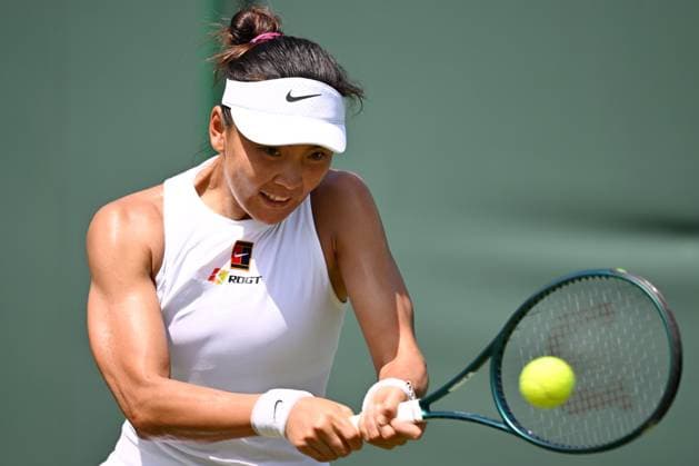 (250630) -- LONDON, June 30, 2025 -- Yuan Yue hits a return during the women s singles first round match between Eva Lys of Germany and Yuan Yue of China at Wimbledon Tennis Championship in London, Britain, June 30, 2025. ) (SP)BRITAIN-LONDON-TENNIS-WIMBLEDON-WOMEN S SINGLES ZhaoxDingzhe 
