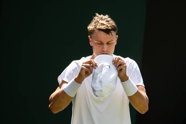 250630 Holger Rune of Denmark looks dejected when competing in a first round singles tennis match during day 1 of Wimbledon on June 30, 2025 in London Photo Petter Arvidson BILDBYRAN kod PA PA1043 tennis wimbledon day 1 bbeng danmark depp  Copyright: PETTERxARVIDSON BB250630PA028