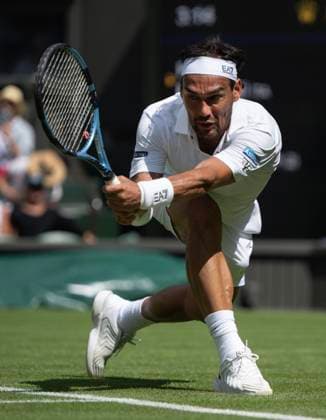 Day One: The Championships - Wimbledon 2025 LONDON, ENGLAND - JUNE 30: Fabio Fognini of Italy in action against Carlos Alcaraz of Spain (not pictured) during their Gentlemen s Singles Ladies Singles first round match on day one of The Championships Wimbledon 2025 at All England Lawn Tennis and Croquet Club on June 30, 2025 in London, England. Fabio Fognini London All England Lawn Tennis and Croq England United Kingdom Copyright: xVisionhausx 776301249