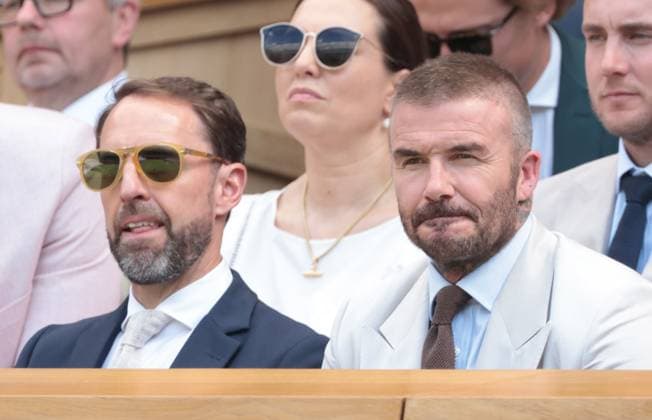 Footballer David Beckham (R) and ex England manager Graham Southgate watch tennis in the Royal Box on day one of the 2025 Wimbledon Championships in London on Monday, June 30, 2025.  LON2025063005 HUGOxPHILPOTT
