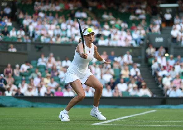 30th June 2025; All England Lawn Tennis and Croquet Club, London, England; Wimbledon Tennis Tournament, Day 1; Katie Boulter (GBR) with a forehand shot to Paula Badosa (ESP)  ActionPlus12807329 JohnxPatrickxFletcher