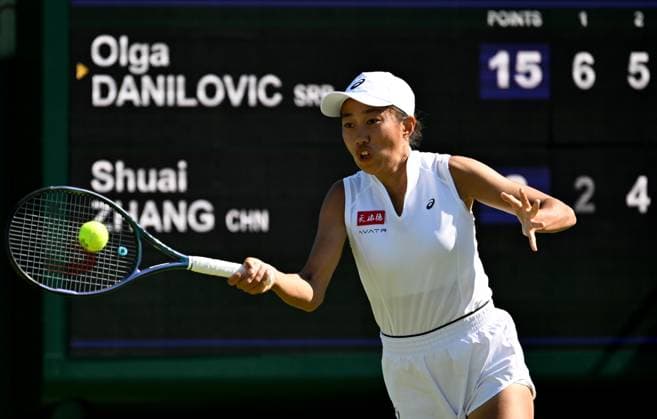 (250701) -- LONDON, July 1, 2025 -- Zhang Shuai hits a return during the women s singles first round match between Zhang Shuai of China and Olga Danilovic of Serbia at Wimbledon tennis Championship in London, Britain, June 30, 2025. ) (SP)BRITAIN-LONDON-TENNIS-WIMBLEDON-WOMEN S SINGLES LixYing 