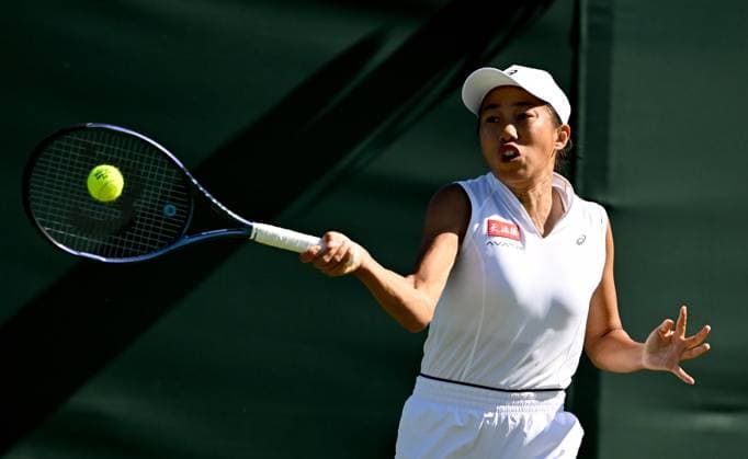 (250701) -- LONDON, July 1, 2025 -- Zhang Shuai hits a return during the women s singles first round match between Zhang Shuai of China and Olga Danilovic of Serbia at Wimbledon tennis Championship in London, Britain, June 30, 2025. ) (SP)BRITAIN-LONDON-TENNIS-WIMBLEDON-WOMEN S SINGLES LixYing 