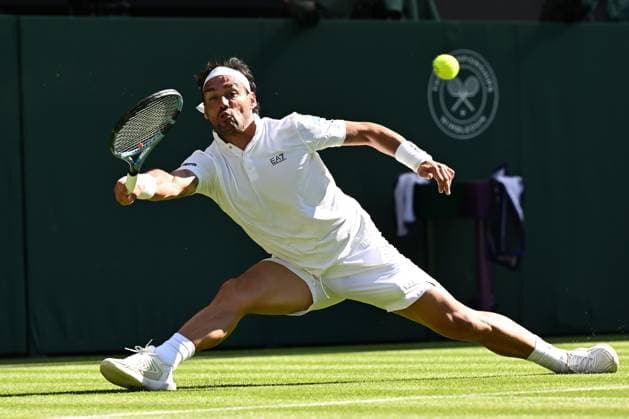 (250701) -- LONDON, July 1, 2025 -- Fabio Fognini serves during the men s singles first round match between Carlos Alcaraz of Spain and Fabio Fognini of Italy at Wimbledon Tennis Championship in London, Britain, June 30, 2025. ) ) (SP)BRITAIN-LONDON-TENNIS-WIMBLEDON-MEN S SINGLES ZhaoxDingzhe 