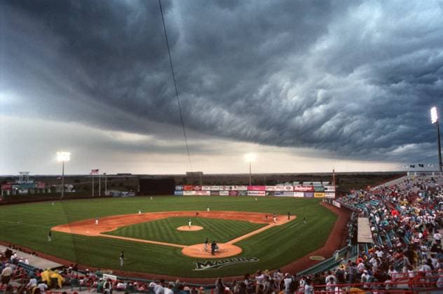 Saturday February 28, 1998: A strong line of thunderstorms blew in over Space Coast Stadium in Viera as the Devil Rays were taking on the Marlins. The bottom fell out and the game was called in the second inning. - - Times Photo by: Jonathan Newton - - Story By: topkin - - SCANNED BY: newton - - RUN DATE: Copyright: xTampaxBayxTimesx