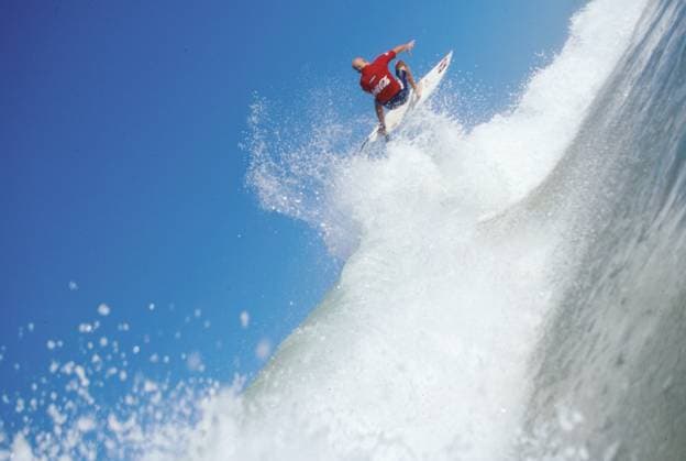 Apr 05, 1999; Huntington Beach, California, USA; Surfing Lifestyles: Surfer launching himself into the air off the lip of the wave.. Copyright: xRonxBrazilx