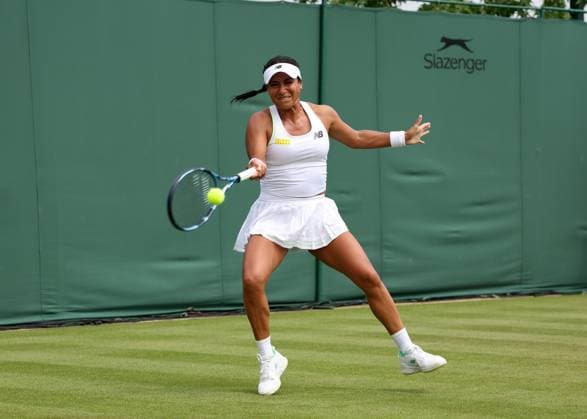 1st July 2025; All England Lawn Tennis and Croquet Club, London, England; Wimbledon Tennis Tournament, Day 2; Heather Watson (GBR) with a forehand shot to Clara Tauson (DEN)  ActionPlus12807372 JohnxPatrickxFletcher