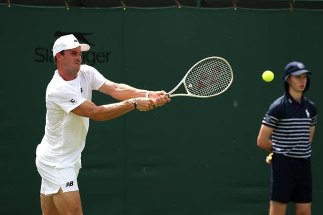 1st July 2025; All England Lawn Tennis and Croquet Club, London, England; Wimbledon Tennis Tournament, Day 2; Tommy Paul (USA) with a backhand shot to Johannus Monday (GBR)  ActionPlus12807380 JohnxPatrickxFletcher