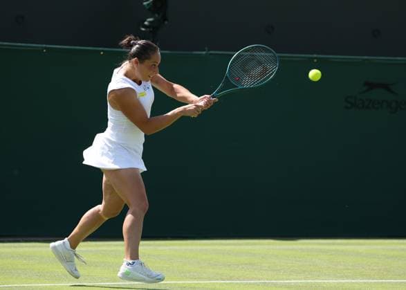 1st July 2025; All England Lawn Tennis and Croquet Club, London, England; Wimbledon Tennis Tournament, Day 2; Elisabetta Cocciaretto (ITA) with a backhand shot to Jessica Pegula (USA)  ActionPlus12807357 JohnxPatrickxFletcher