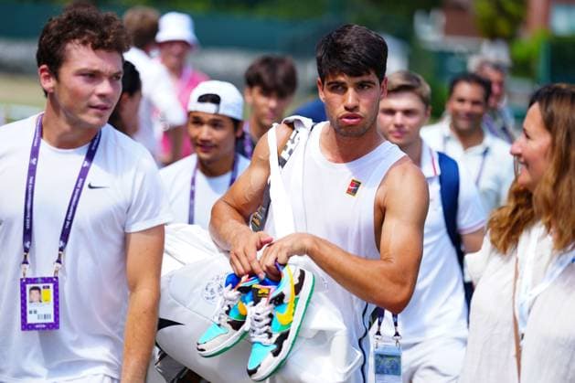 Carlos Alcaraz on the practice courts holding a pair of Nike Dunk shoes Wimbledon Tennis Championships, Day 2, The All England Lawn Tennis and Croquet Club, London, UK - 01 Jul 2025London The All England Lawn Tennis and United Kingdom  Copyright: xJavierxGarcia Shutterstockx 15380417bg