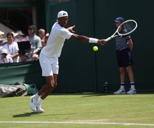 American Chris Eubanks plays a backhand in his match against Dutch Jesper de Jong on day two of the 2025 Wimbledon Championships in London on Tuesday, July 01, 2025.  LON2025070105 HUGOxPHILPOTT
