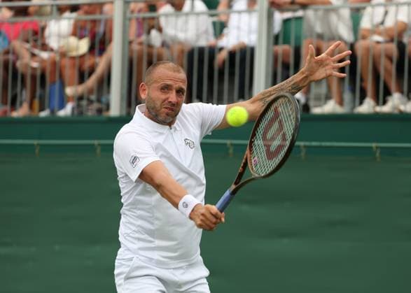 1st July 2025; All England Lawn Tennis and Croquet Club, London, England; Wimbledon Tennis Tournament, Day 2; Daniel Evans (GBR) with a backhand shot to Jay Clarke (GBR)  ActionPlus12807560 JohnxPatrickxFletcher