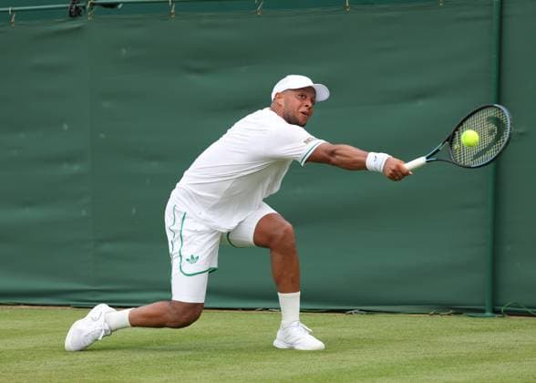 1st July 2025; All England Lawn Tennis and Croquet Club, London, England; Wimbledon Tennis Tournament, Day 2; Jay Clarke (GBR) with a backhand shot to Daniel Evans (GBR)  ActionPlus12807563 JohnxPatrickxFletcher
