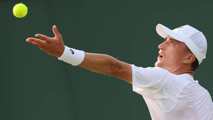 Belgian Raphael Collignon pictured in action at a tennis game against Croatian Cilic, in the first round of the men s singles at the 2025 Wimbledon grand slam tournament, Tuesday 01 July 2025 at the All England Tennis Club, in South-West London, Britain. BENOITxDOPPAGNE  x128221340x