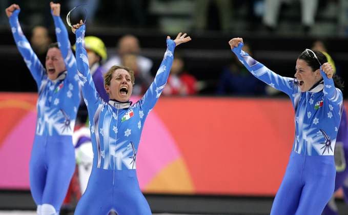 February 22, 2006 - Torino, Italy - From left, Italy s MARA ZINI, MARTA CAPURSO and KATIA ZINI celebrate their team s bronze medal victory in the Women s 3000 meter relay final in Short Track Speed skating, Eisschnelllauf after the judges announced China was disqualified. Copyright: xDanxAndersonx