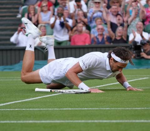 Tennis - 2025 Wimbledon Championships - Men™s Singles - Round One - Alexander Zverev v Arthur Rinderknech All England Lawn Tennis & Croquet Club - Tuesday 1st July 2025 Arthur Rinderknech of FRA drops to his knees after winning match point 