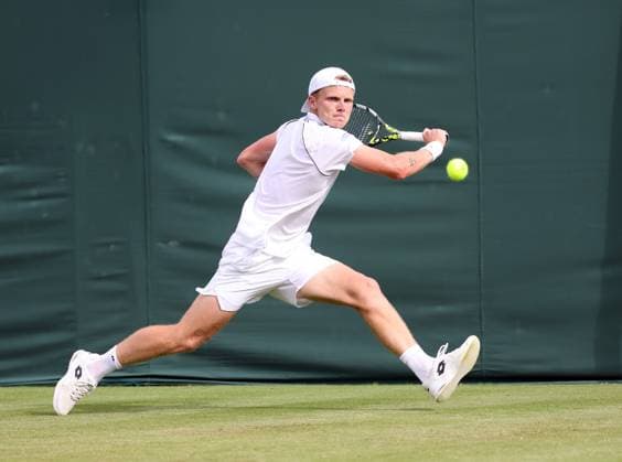 Dutch Jesper De Jong plays a backhand in his match against American Chris Eubanks on day two of the 2025 Wimbledon Championships in London on Tuesday, July 01, 2025.  LON2025070135 HUGOxPHILPOTT