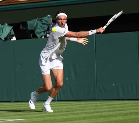 France s Arthur Rinderknech plays a forehand in his match against German Alexander Zverev on day two of the 2025 Wimbledon Championships in London on Tuesday, July 01, 2025.  LON2025070144 HUGOxPHILPOTT