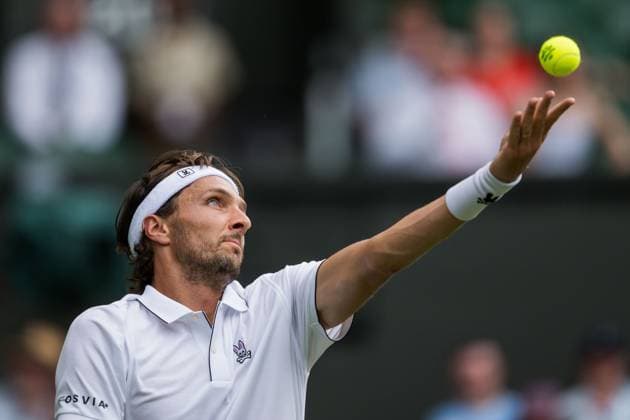 250701 Arthur Rinderknech of France competes in a first round singles tennis match during day 2 of Wimbledon on July 1, 2025 in London Photo Petter Arvidson BILDBYRAN kod PA PA1045 tennis wimbledon day 2 bbeng  Copyright: PETTERxARVIDSON BB250701PA046
