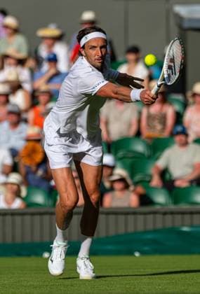 Tennis - Wimbledon Championship 2025 - Day 2 LONDON, ENGLAND - Tuesday, July 1, 2025: Arthur Rinderknech (FRA) with a back-hand return during the Gentlemen s Singles 1st Round on Day Two of The Championships Wimbledon 2025 at the All England Lawn Tennis and Croquet Club. Rinderknech won 7-6(3) 6-7(10) 6-3 6-7(7) 6-4. (Photo by Kirsten Holst Propaganda) LONDON All England Lawn Tennis and Croquet Club GREATER LONDON ENGLAND  Copyright: xKirstenxHolstx 2025-07-01-126-Wimbledon_Day_2