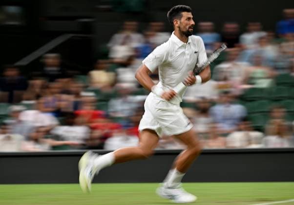 (250702) -- LONDON, July 2, 2025 -- Novak Djokovic competes during the men s singles first round match between Novak Djokovic of Serbia and Alexandre Muller of France at the Wimbledon Tennis Championships in London, Britain, July 1, 2025. ) (SP)BRITAIN-LONDON-TENNIS-WIMBLEDON-MEN S SINGLES LixYing 