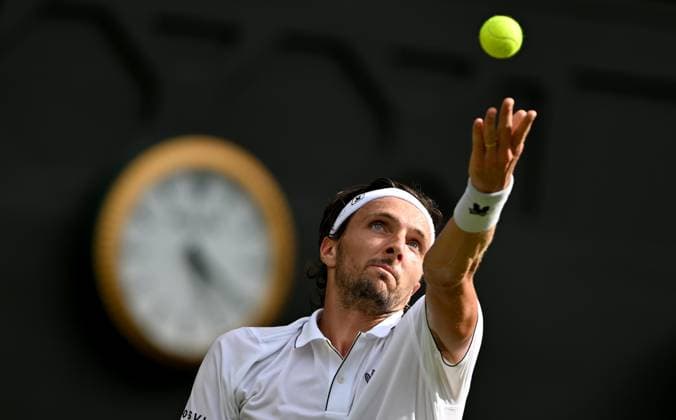 (250702) -- LONDON, July 2, 2025 -- Arthur Rinderknech serves during the men s singles first round match between Alexander Zverev of Germany and Arthur Rinderknech of France at the Wimbledon Tennis Championships in London, Britain, July 1, 2025. ) (SP)BRITAIN-LONDON-TENNIS-WIMBLEDON-MEN S SINGLES LixYing 
