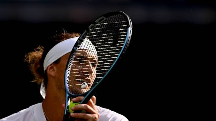 (250702) -- LONDON, July 2, 2025 -- Alexander Zverev prepares to serve during the men s singles first round match between Alexander Zverev of Germany and Arthur Rinderknech of France at the Wimbledon Tennis Championships in London, Britain, July 1, 2025. ) (SP)BRITAIN-LONDON-TENNIS-WIMBLEDON-MEN S SINGLES LixYing 