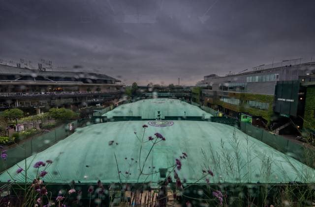 250702 Covers are seen on the outside courts due to rain during day 3 of Wimbledon on July 2, 2025 in London Photo Petter Arvidson BILDBYRAN kod PA PA1047 tennis wimbledon day 3 bbeng rain rain cover  Copyright: PETTERxARVIDSON BB250702PA001