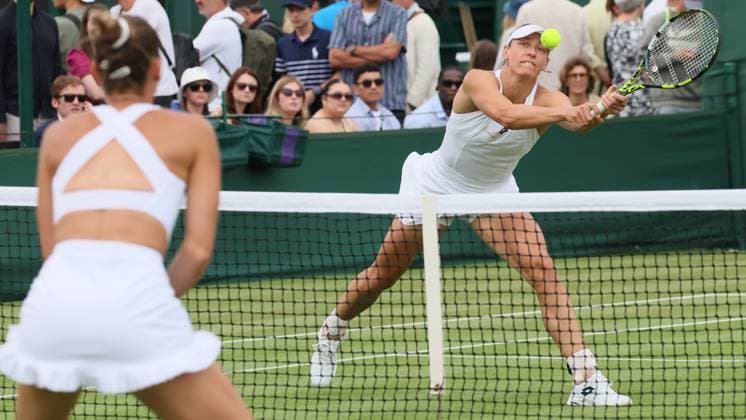 Belgian Yanina Wickmayer pictured in action during a doubles tennis match with Belgian-Latvian pair Wickmayer - Sevastova against Ukrainian-Romanian pair Kostyuk - Ruse, in the first round of the women s doubles at the 2025 Wimbledon grand slam tournament, Wednesday 02 July 2025 at the All England Tennis Club, in South-West London, Britain. BENOITxDOPPAGNE  x128265533x