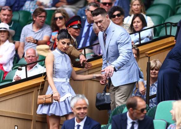 Wimbledon Championships 2025 AELTC, Day Two, London, UK - 02 07 2025 Former Professional Wrestler John Cena and his wife Shay are directed to their seats in the Royal Box at Wimbledon on day three of the Championships London Wimbledon London GBR, UK NEWSPAPERS OUT Copyright: xMarkxGreenwoodx