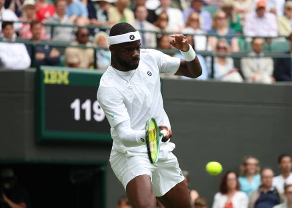 2nd July 2025; All England Lawn Tennis and Croquet Club, London, England; Wimbledon Tennis Tournament, Day 3; Frances Tiafoe (FRA) with a forehand shot to Cameron Norrie (GBR)  ActionPlus12807852 JohnxPatrickxFletcher