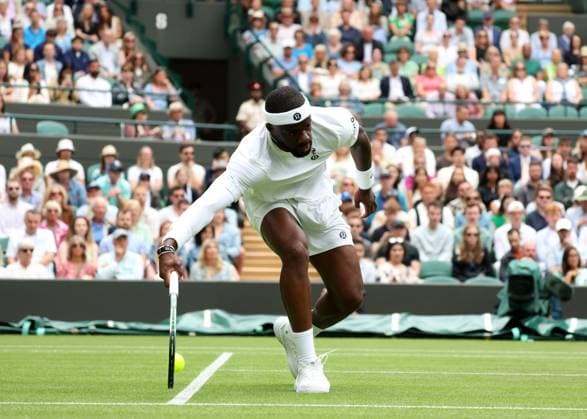 2nd July 2025; All England Lawn Tennis and Croquet Club, London, England; Wimbledon Tennis Tournament, Day 3; Frances Tiafoe (FRA) reaches for a forehand shot to Cameron Norrie (GBR)  ActionPlus12807854 JohnxPatrickxFletcher