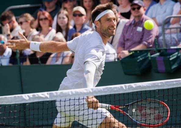 Belgian Sander Gille pictured in action during a doubles tennis match with Belgian-Indian pair Gille - Bopanna against German pair Putz - Krawietz, in the first round of the men s doubles at the 2025 Wimbledon grand slam tournament, Wednesday 02 July 2025 at the All England Tennis Club, in South-West London, Britain. BENOITxDOPPAGNE  x128277475x