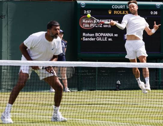 Indian Rohan Bopanna and Belgian Sander Gille pictured during a doubles tennis match with Belgian-Indian pair Gille - Bopanna against German pair Putz - Krawietz, in the first round of the men s doubles at the 2025 Wimbledon grand slam tournament, Wednesday 02 July 2025 at the All England Tennis Club, in South-West London, Britain. BENOITxDOPPAGNE  x128277952x