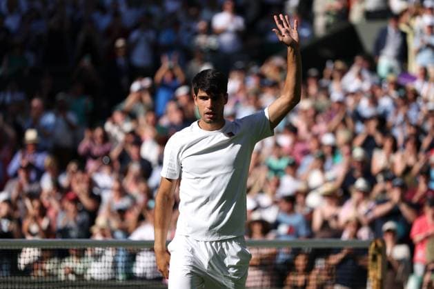 2nd July 2025; All England Lawn Tennis and Croquet Club, London, England; Wimbledon Tennis Tournament, Day 3; Defending Wimbledon Champion Carlos Alcaraz (ESP) waves to the fans after defeating Oliver Tarvet (GBR) in straight sets to reach the next round  ActionPlus12807974 JohnxPatrickxFletcher