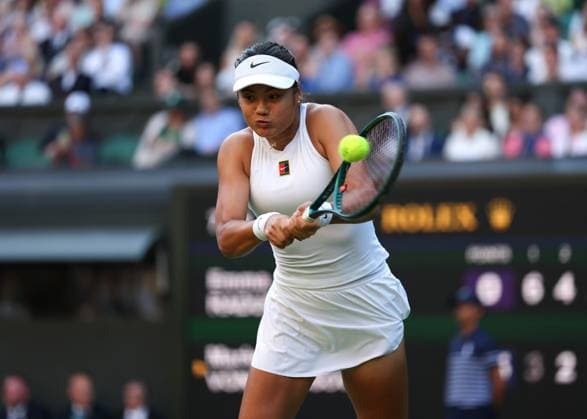 2nd July 2025; All England Lawn Tennis and Croquet Club, London, England; Wimbledon Tennis Tournament, Day 3; Emma Raducanu (GBR) with a backhand shot to Marketa Vondrousova (CZE)  ActionPlus12808030 JohnxPatrickxFletcher