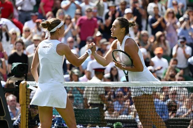 (250703) -- LONDON, July 3, 2025 -- Aryna Sabalenka (R) greets Marie Bouzkova after the women s singles second round match between Aryna Sabalenka of Belarus and Marie Bouzkova of the Czech Republic at the Wimbledon Tennis Championships in London, Britain, July 2, 2025. ) (SP)BRITAIN-LONDON-TENNIS-WIMBLEDON-WOMEN S SINGLES ZhaoxDingzhe 
