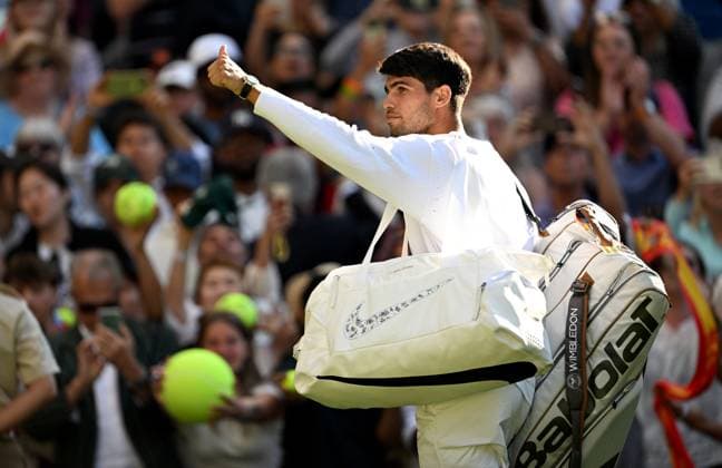 (250703) -- LONDON, July 3, 2025 -- Carlos Alcaraz greets the spectators after winning the men s singles second round match between Carlos Alcaraz of Spain and Oliver Tarvet of Britain at the Wimbledon Tennis Championships in London, Britain, July 2, 2025. ) (SP)BRITAIN-LONDON-TENNIS-WIMBLEDON-MEN S SINGLES LixYing 