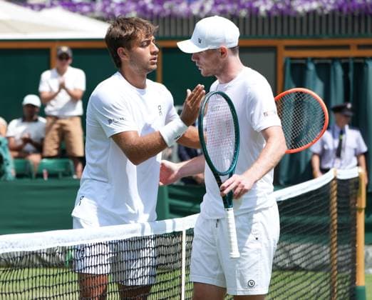 Tennis - 2025 Wimbledon Championships - Men™s Singles - 2nd round - Flavio Cobolli v Jack Pennington Jones All England Lawn Tennis & Croquet Club - Thursday 3rd July 2025 Flavio Cobolli (Italy) consoles Jack Pennington Jones after the match 