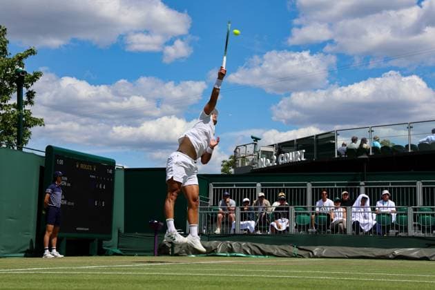 3rd July 2025; All England Lawn Tennis and Croquet Club, London, England; Wimbledon Tennis Tournament, Day 4; Marcos Giron (USA) serves to Jakub Mensik (CZE) on Court number twelve  ActionPlus12808082 JohnxPatrickxFletcher