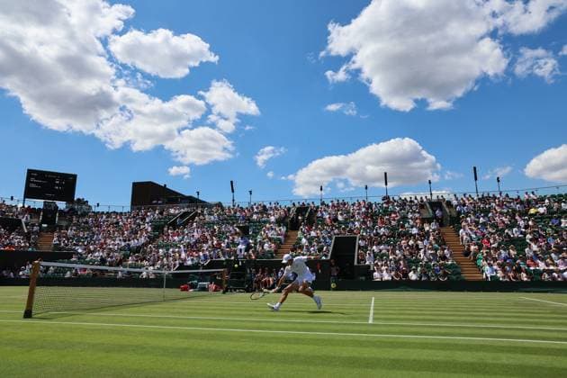 3rd July 2025; All England Lawn Tennis and Croquet Club, London, England; Wimbledon Tennis Tournament, Day 4; Alex de Minaur (AUS) with a backhand shot at the net to Arthur Cazaux (FRA) inside a packed court number two  ActionPlus12808084 JohnxPatrickxFletcher