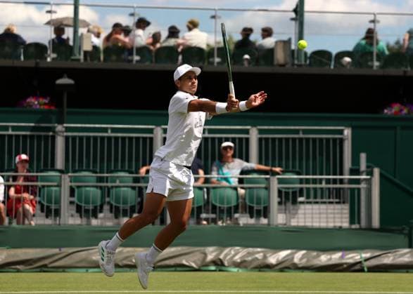3rd July 2025; All England Lawn Tennis and Croquet Club, London, England; Wimbledon Tennis Tournament, Day 4; Marcos Giron (USA) with a forehand shot to Jakub Mensik (CZE)  ActionPlus12808094 JohnxPatrickxFletcher